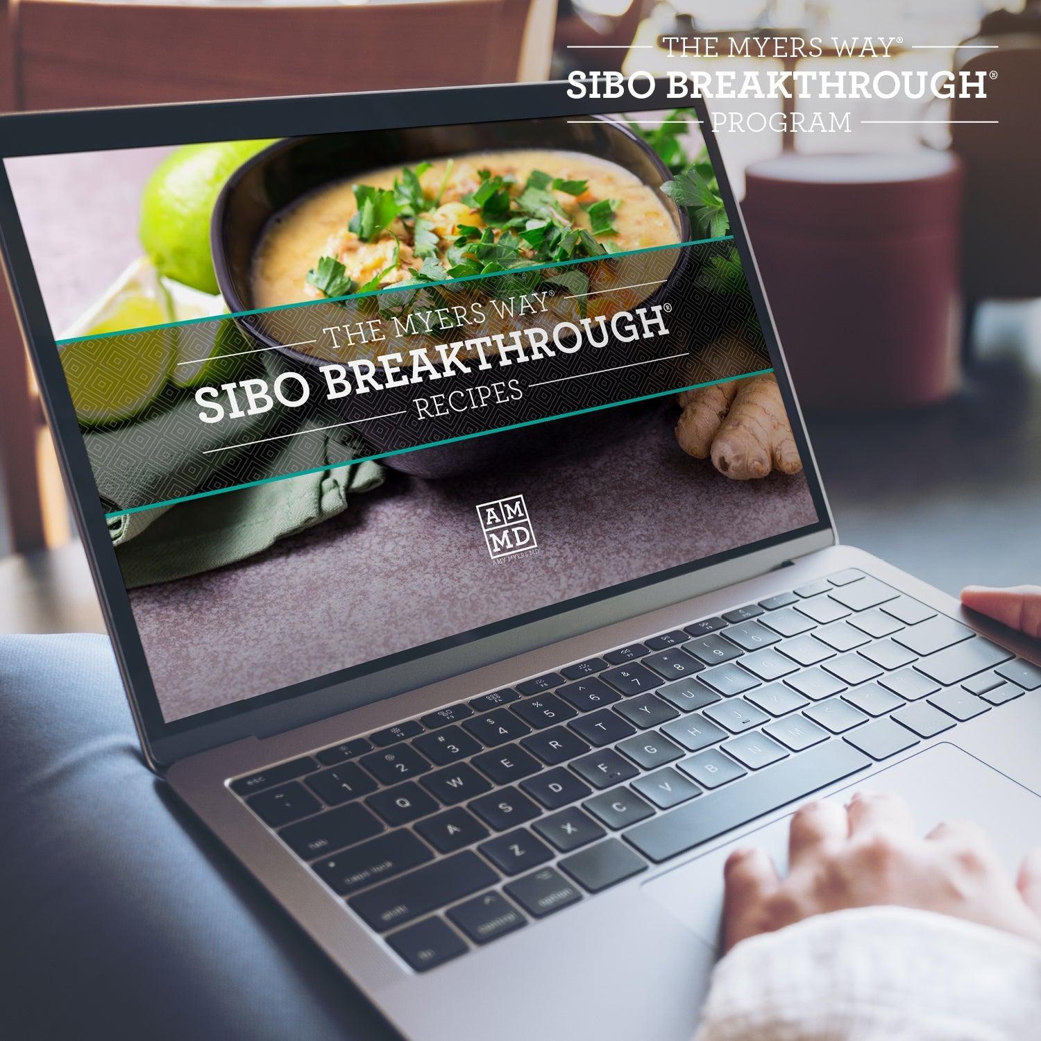 A Woman views the SIBO Breakthrough Recipes on a laptop computer - Amy Myers MD®