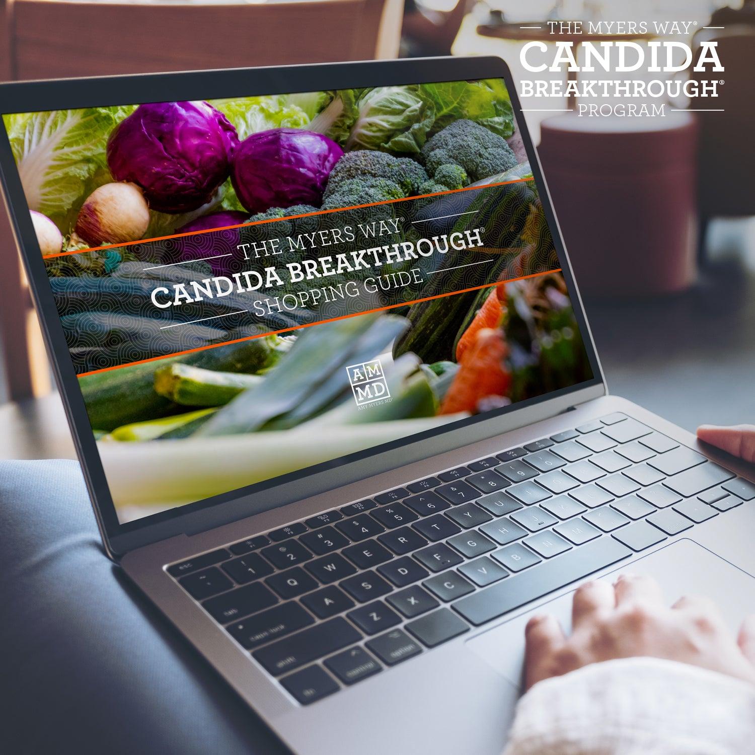 A Woman views the Upgraded Candida Breakthrough Program Shopping Guide on a laptop computer - Amy Myers MD®