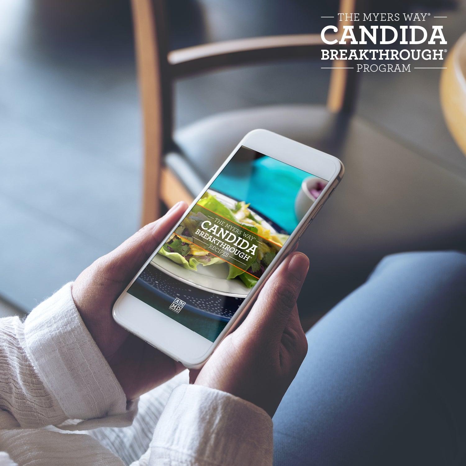 A Woman views The Upgraded Candida Breakthrough Program Recipes on a smart phone - Amy Myers MD®