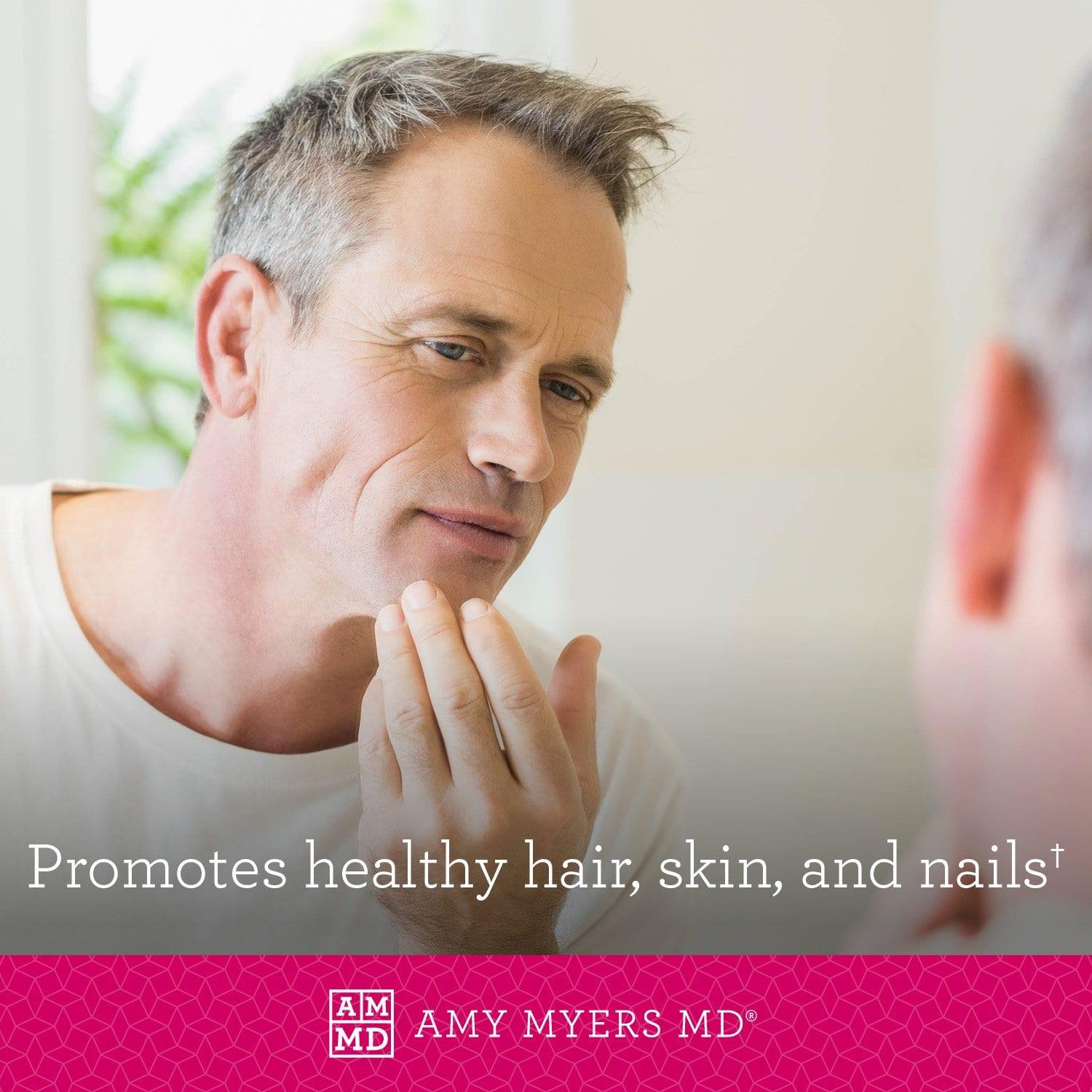 Man looking in mirror at healthy skin and hair - Amy Myers MD®
