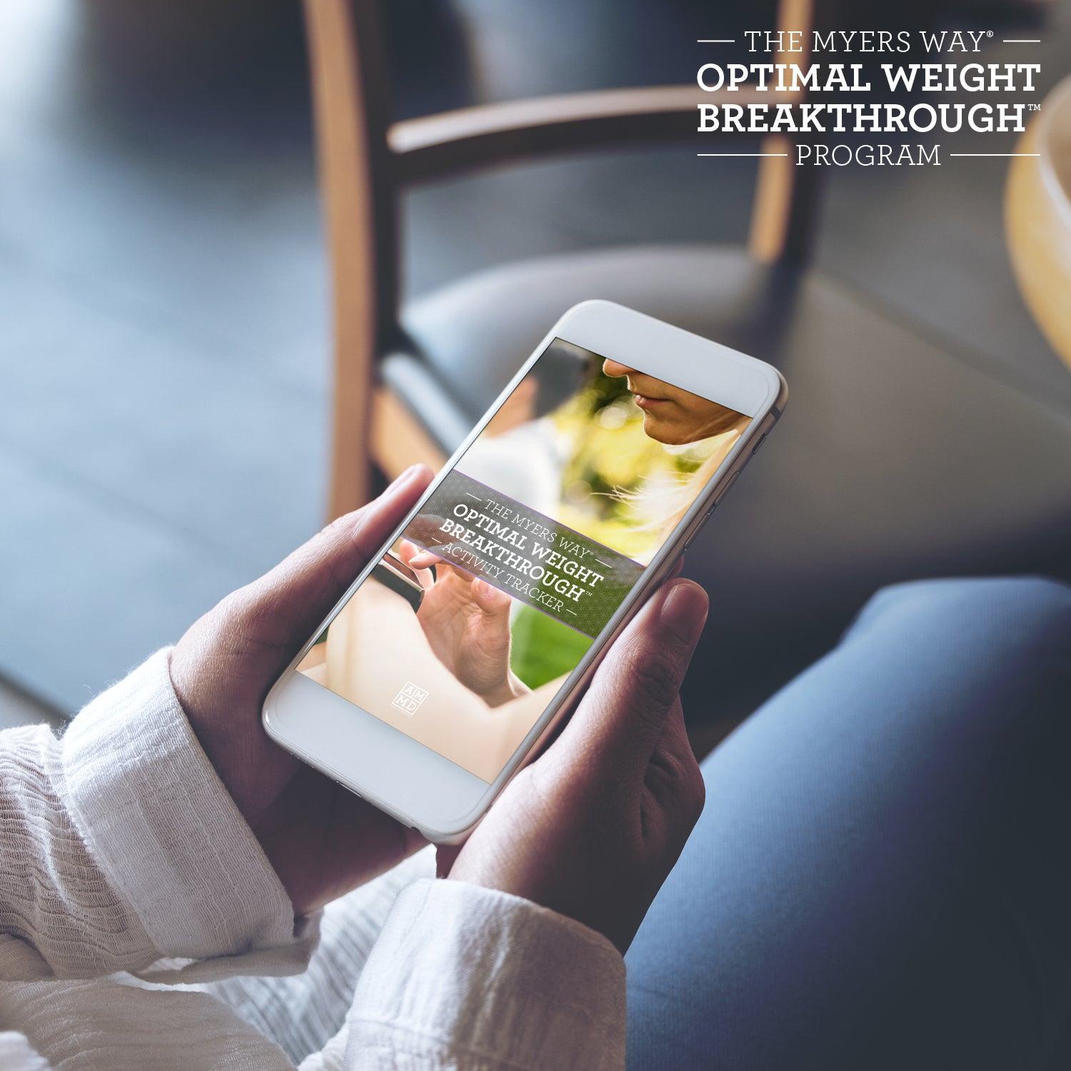 A Woman uses the Optimal Weight Breakthrough Program Activity Tracker on a smart phone - Amy Myers MD®