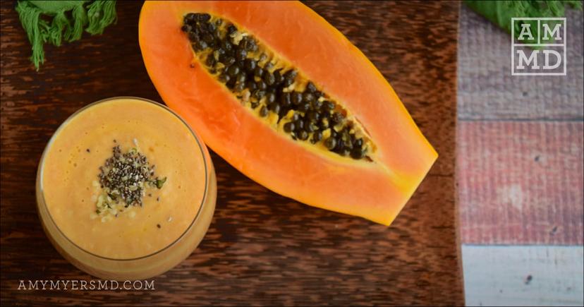 Smoothie next to papaya - Anti-Inflammatory Smoothie Recipe - Amy Myers MD