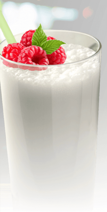 The Myers Way® Vanilla Bean Paleo Protein shake in a tall glass with raspberries on top.