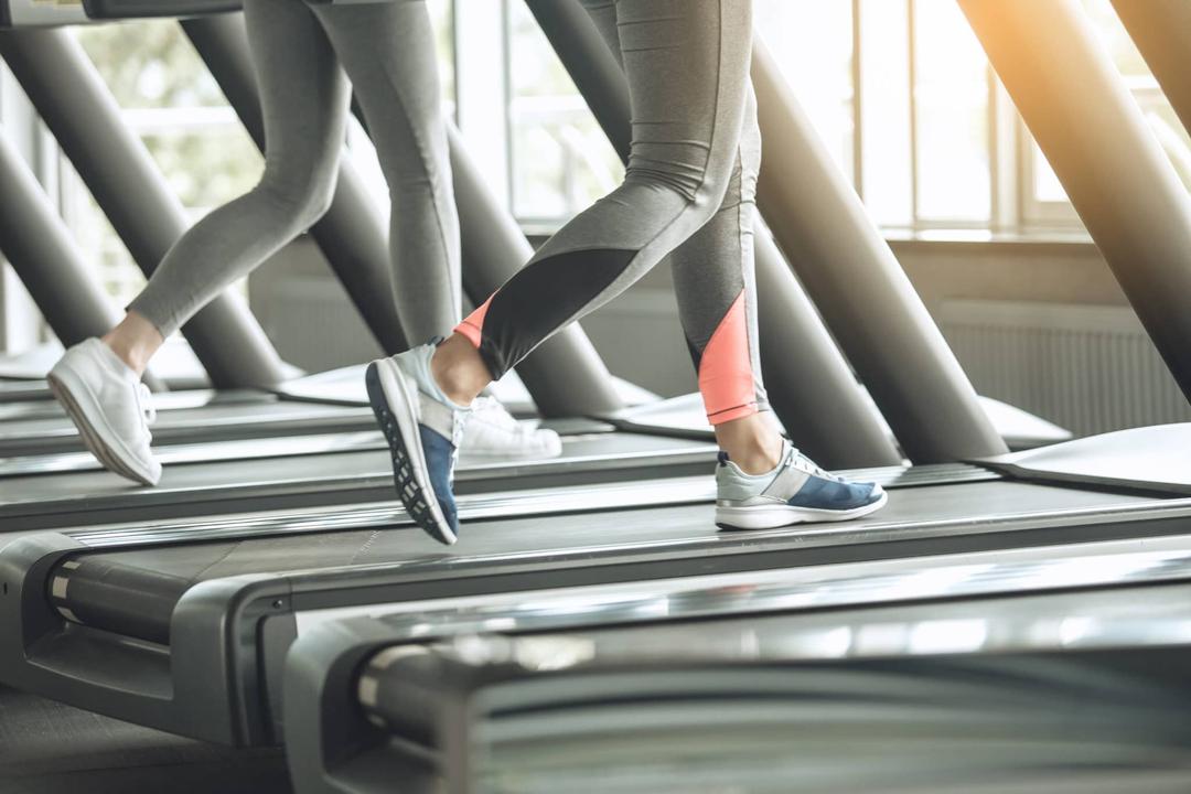 Women walking on a treadmill.