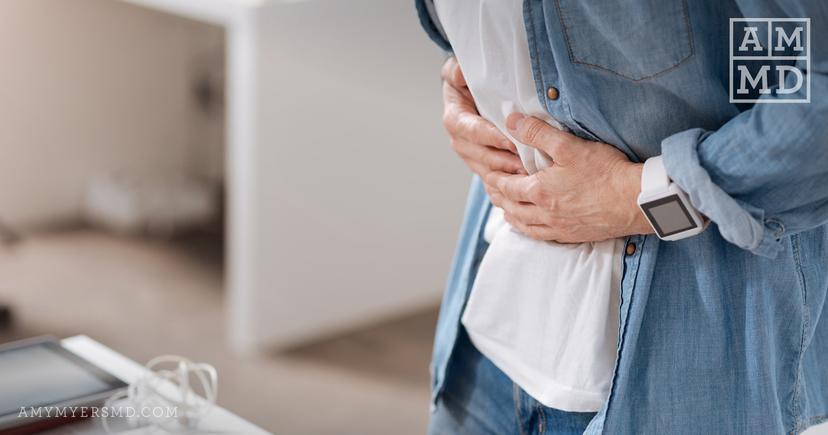 Holding stomach - How Do I Know If I Have Sibo vs Candida? - Amy Myers MD®