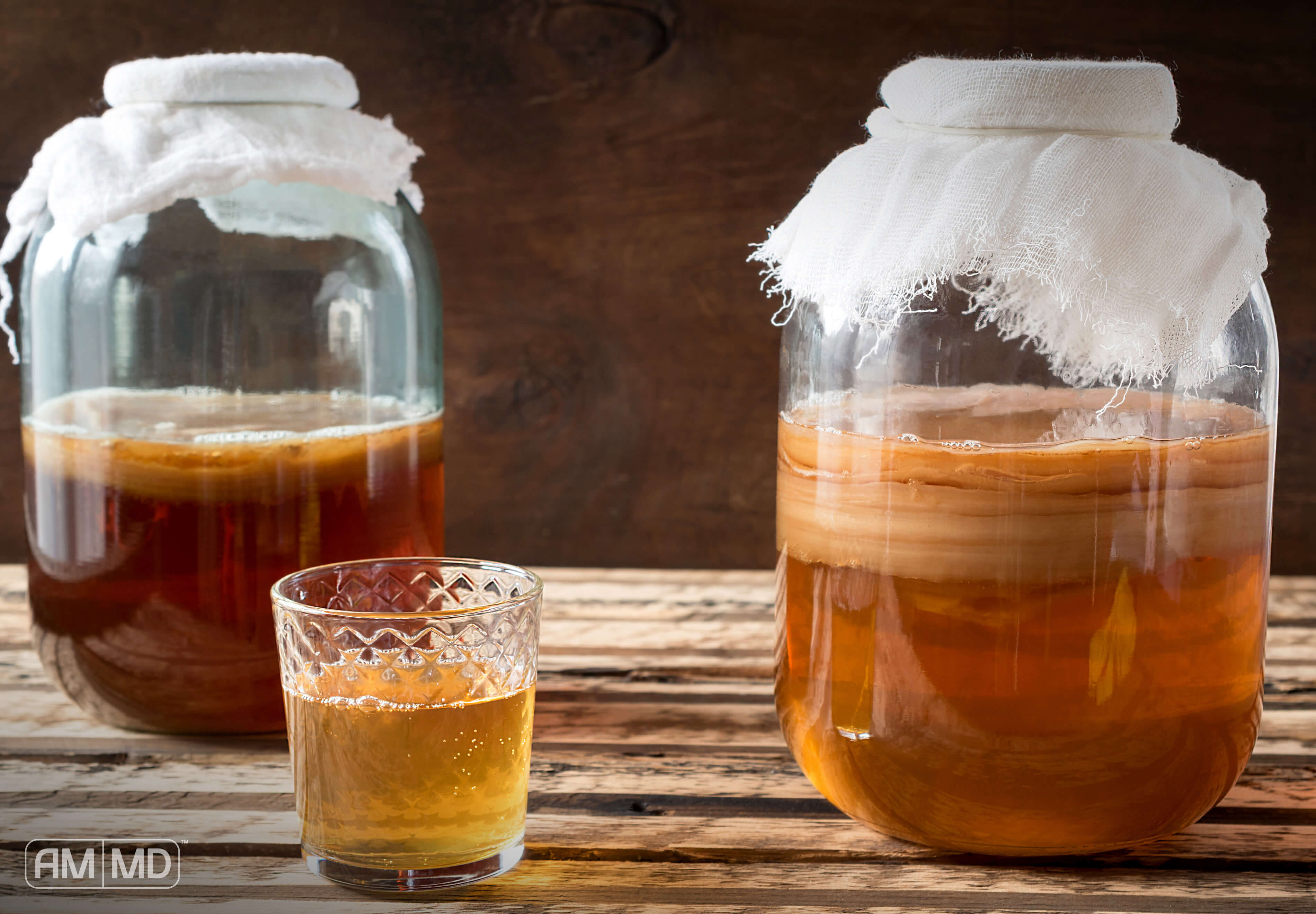 Kombucha jars sitting on a table, Can Kombucha Make You Sick?