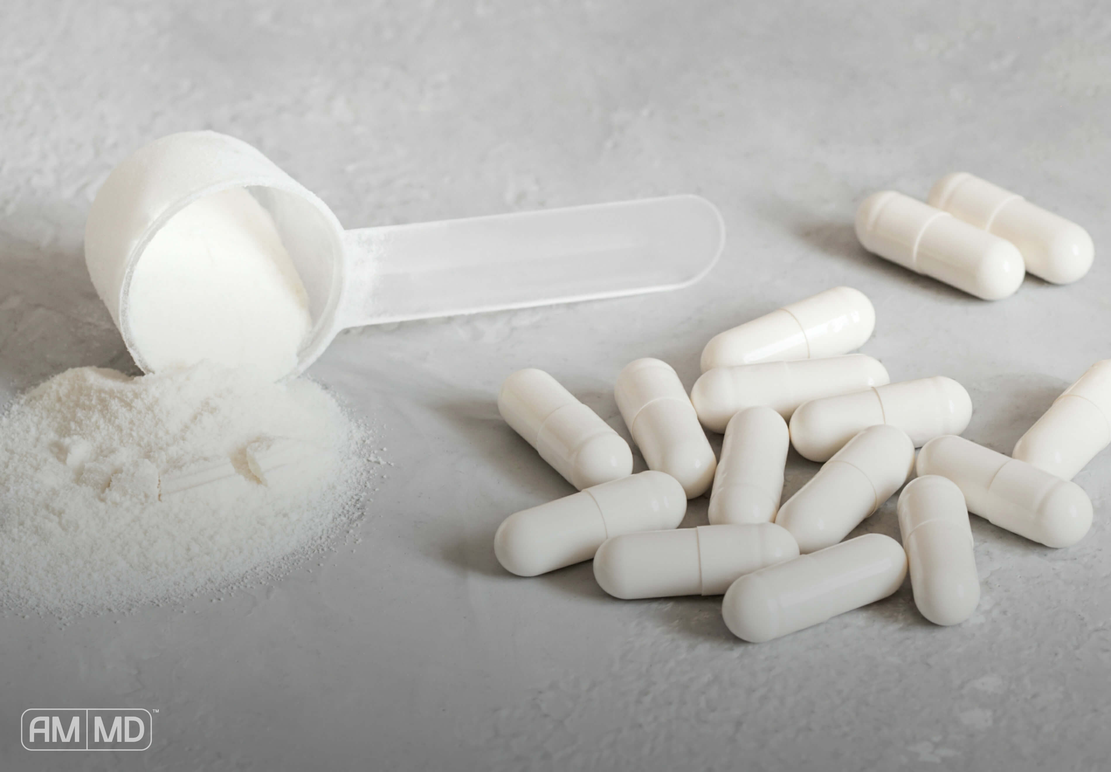 Collagen Protein powder on a table next to a scooper.