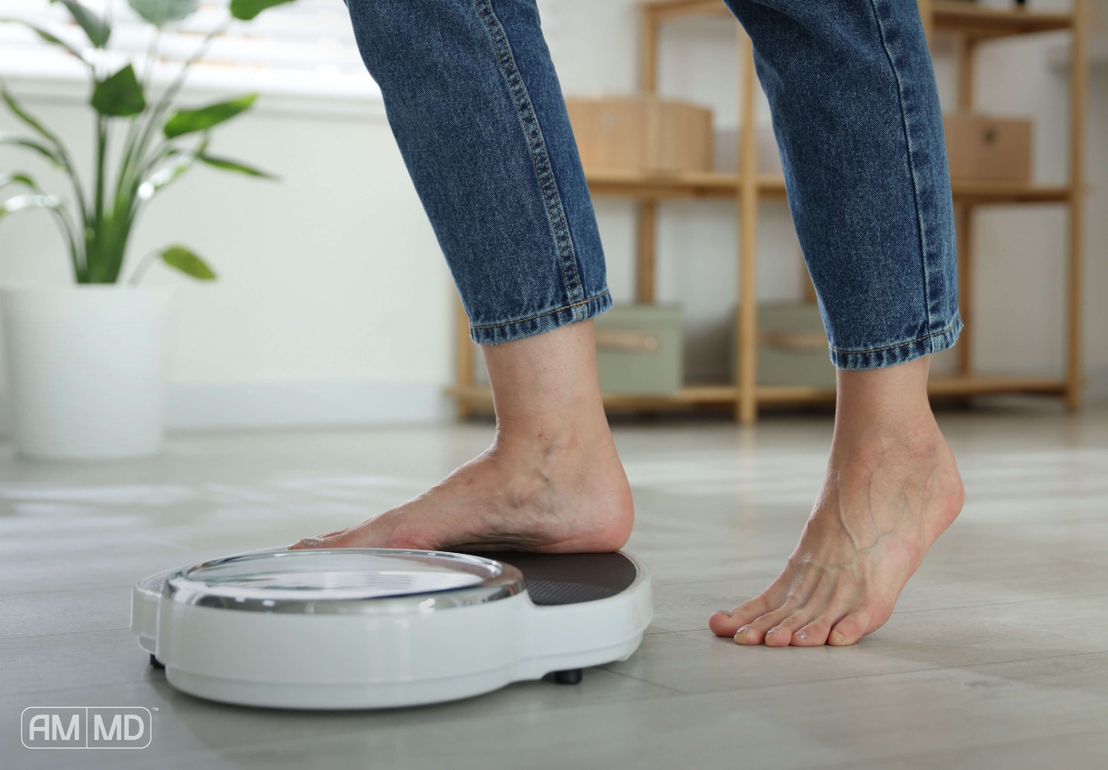 Woman stepping on a scale - Yes, You Can Lose Weight After 40!