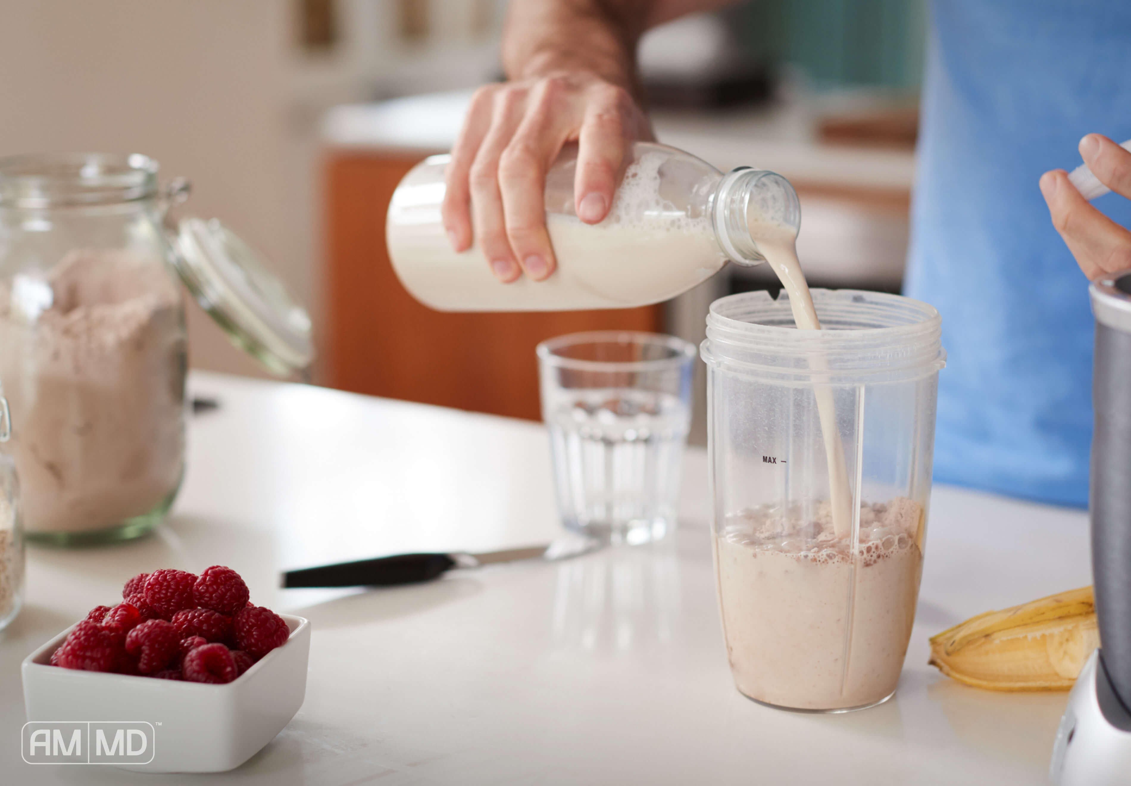 Man pouring milk - Your Protein Guide - Amy Myers MD®