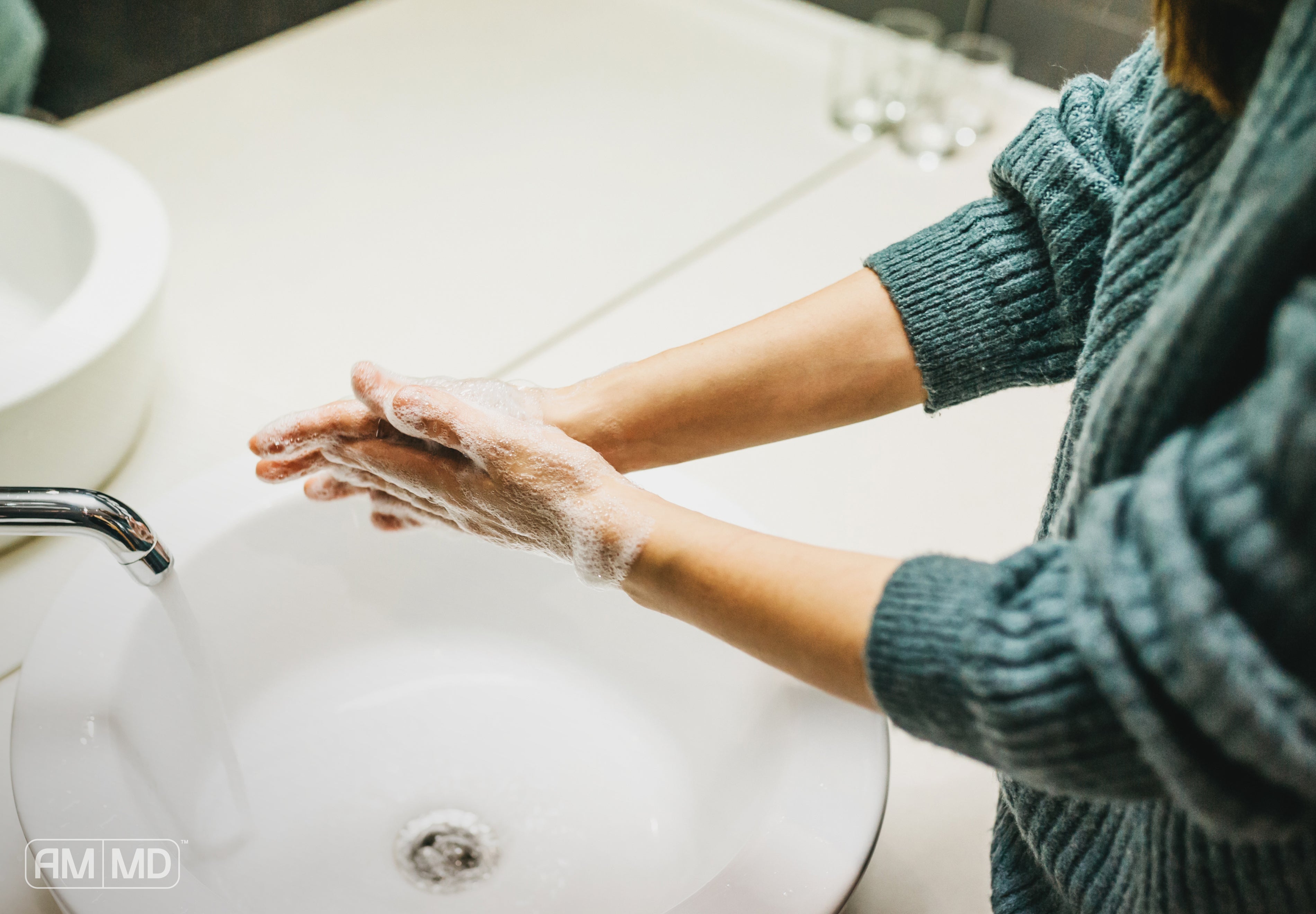 Woman washing hands - 10 Flu Prevention Tips & Immune Support - AMMD™