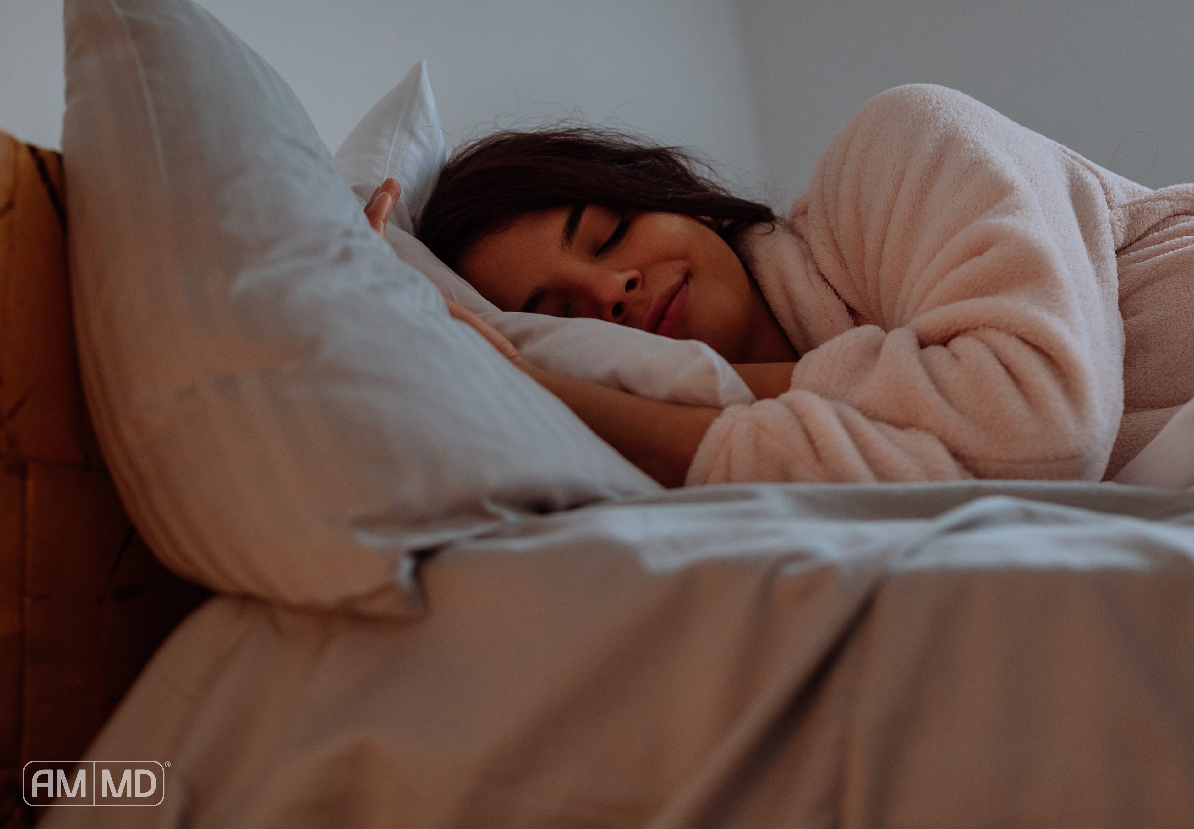 Woman sleeping - 7 Steps to Reset Your Sleep Cycle - AMMD™