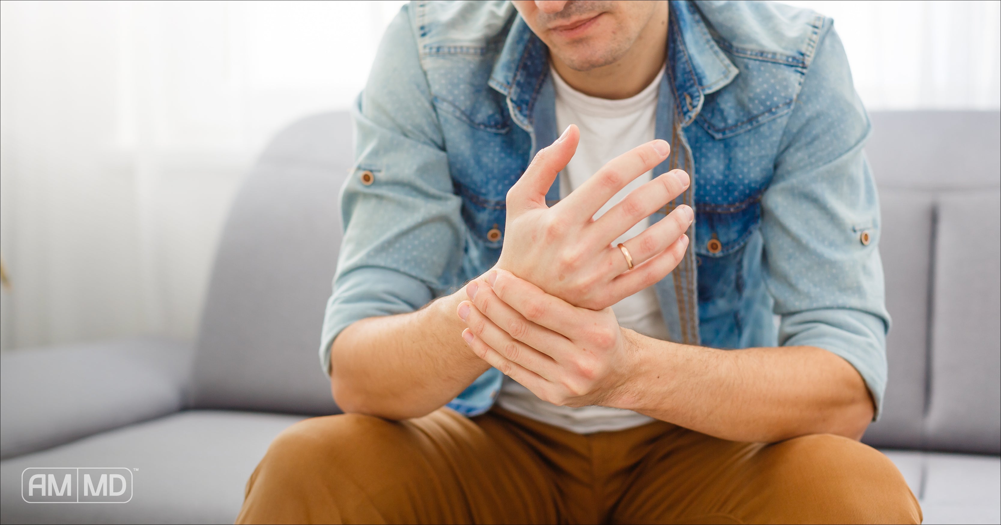 Man holding his wrist - Common Autoimmune Diseases in Men - Amy Myer MD®