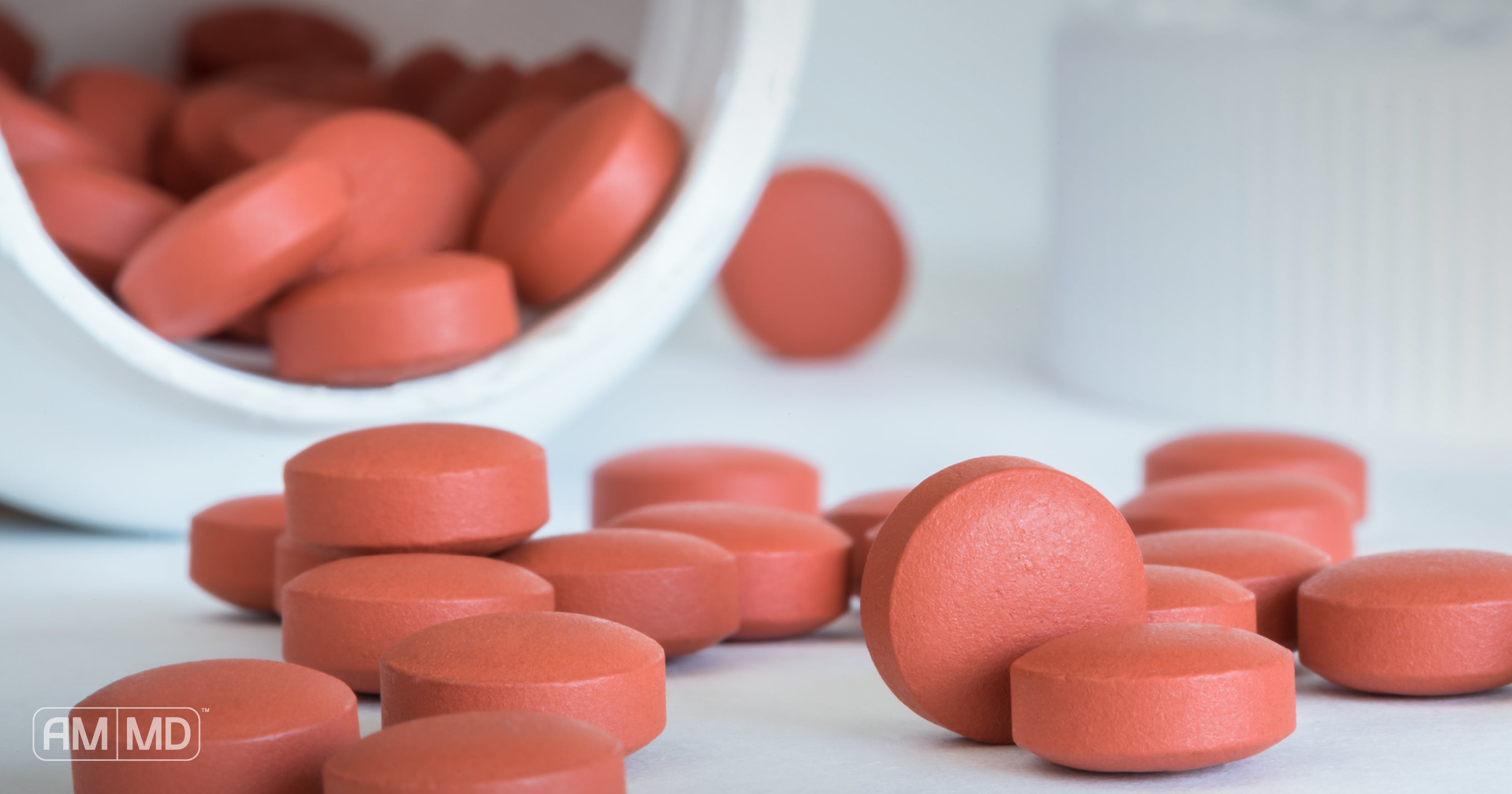 Tables of NSAIDs pouring out of bottle - Gut Repair after Using NSAIDs - AMMD™