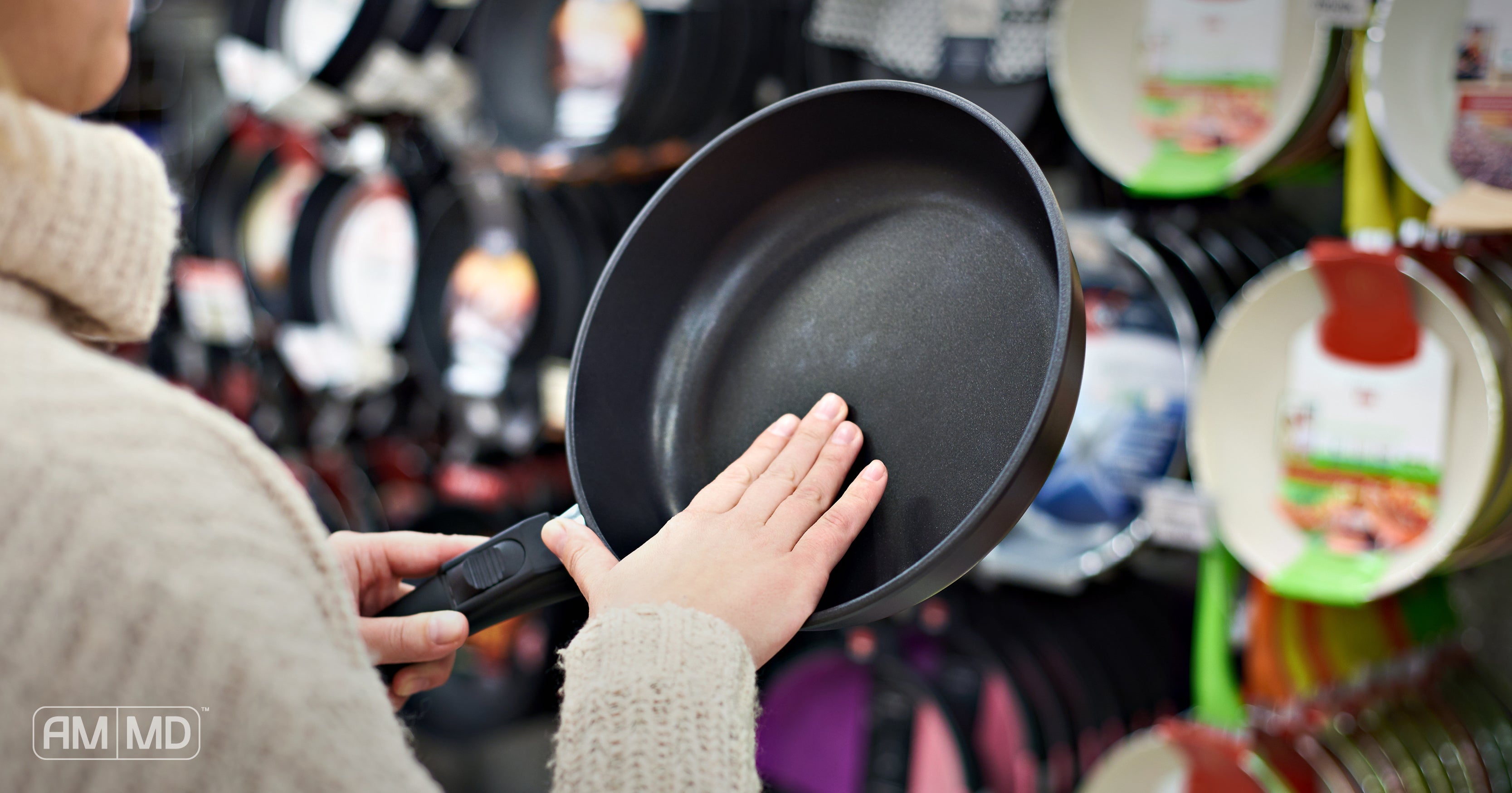 Woman holding cookware - Healthy Cookware Shopping Guide - AMMD™