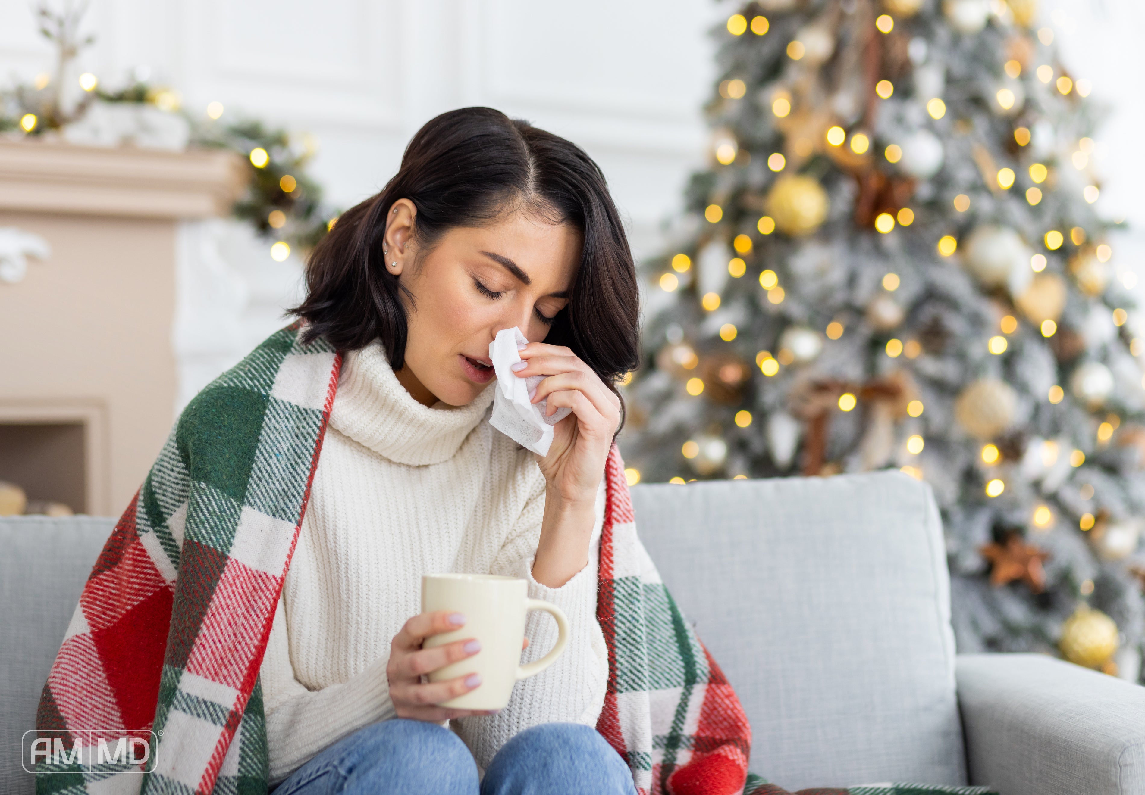 Woman blowing her nose - Holiday Sickness: Why You Feel Ill After the Festive Season - AMMD™