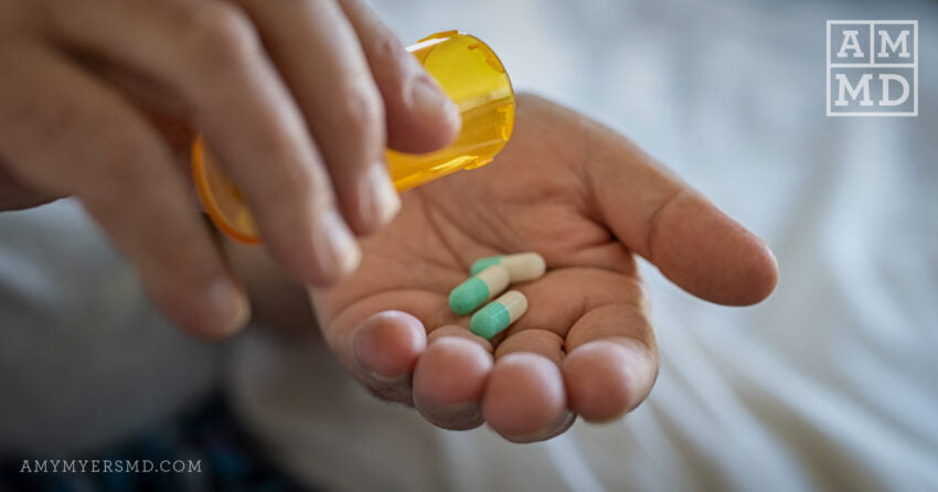 Hand holding a dose of antibiotics - AMDM™