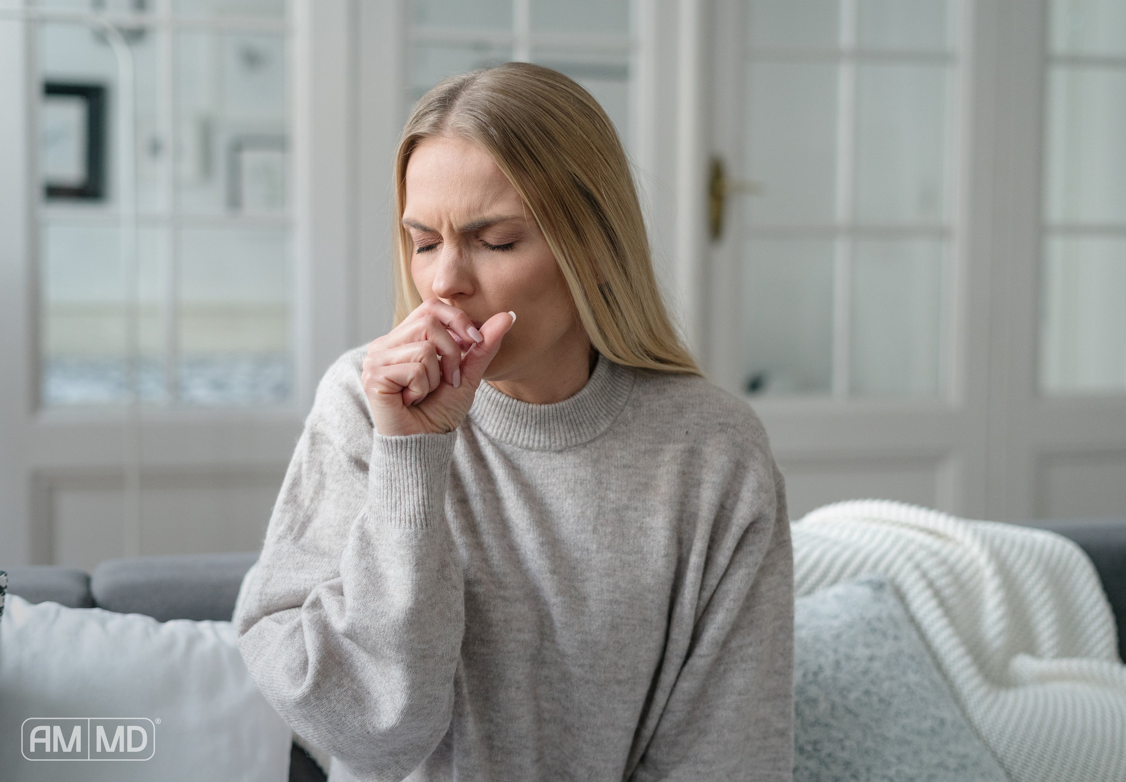 Woman coughing - How to Build Your Immune System - AMMD™