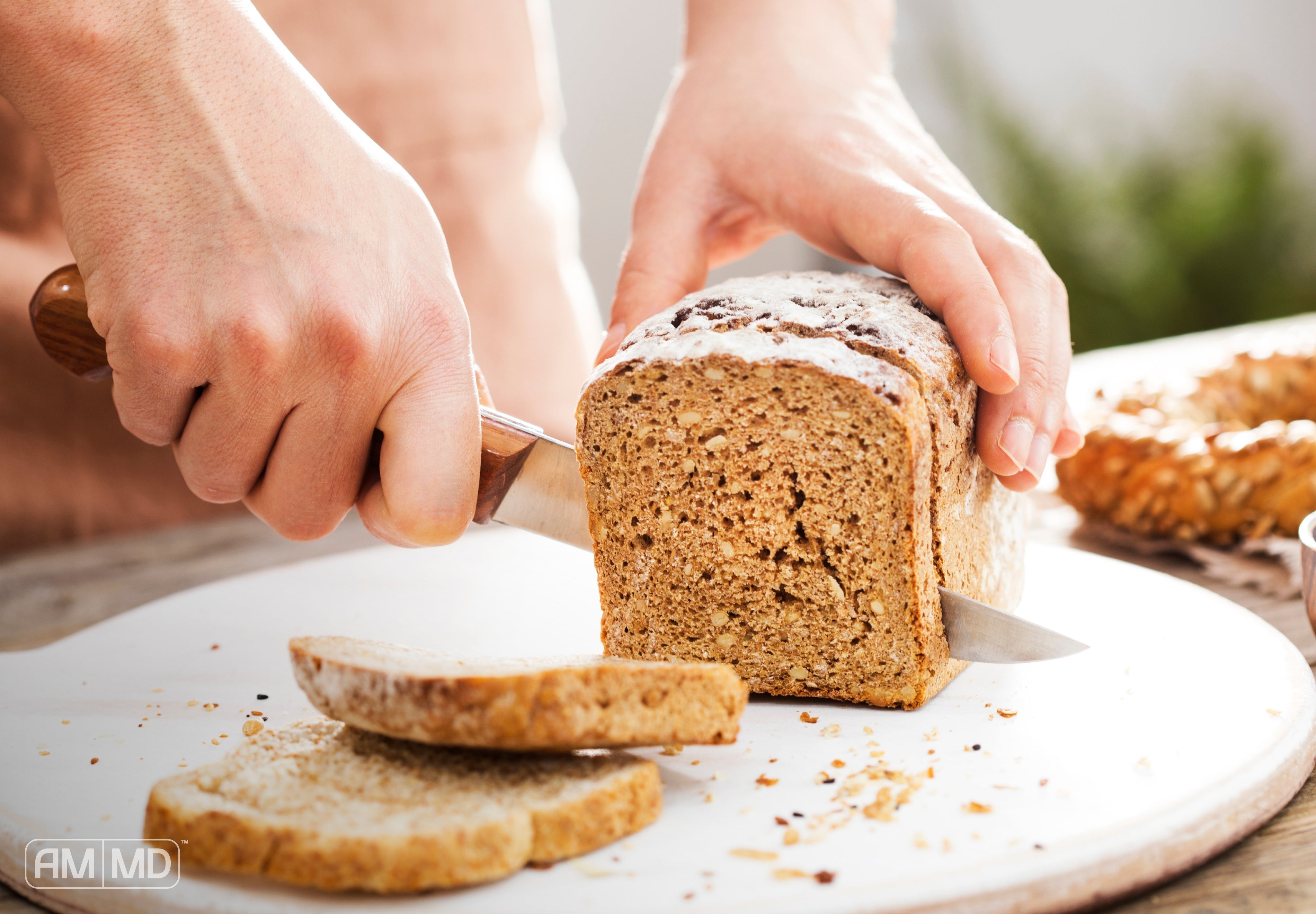 Slicing Whole Wheat Bread - Is Gluten to Blame for Your Thyroid Condition? - AMMD™
