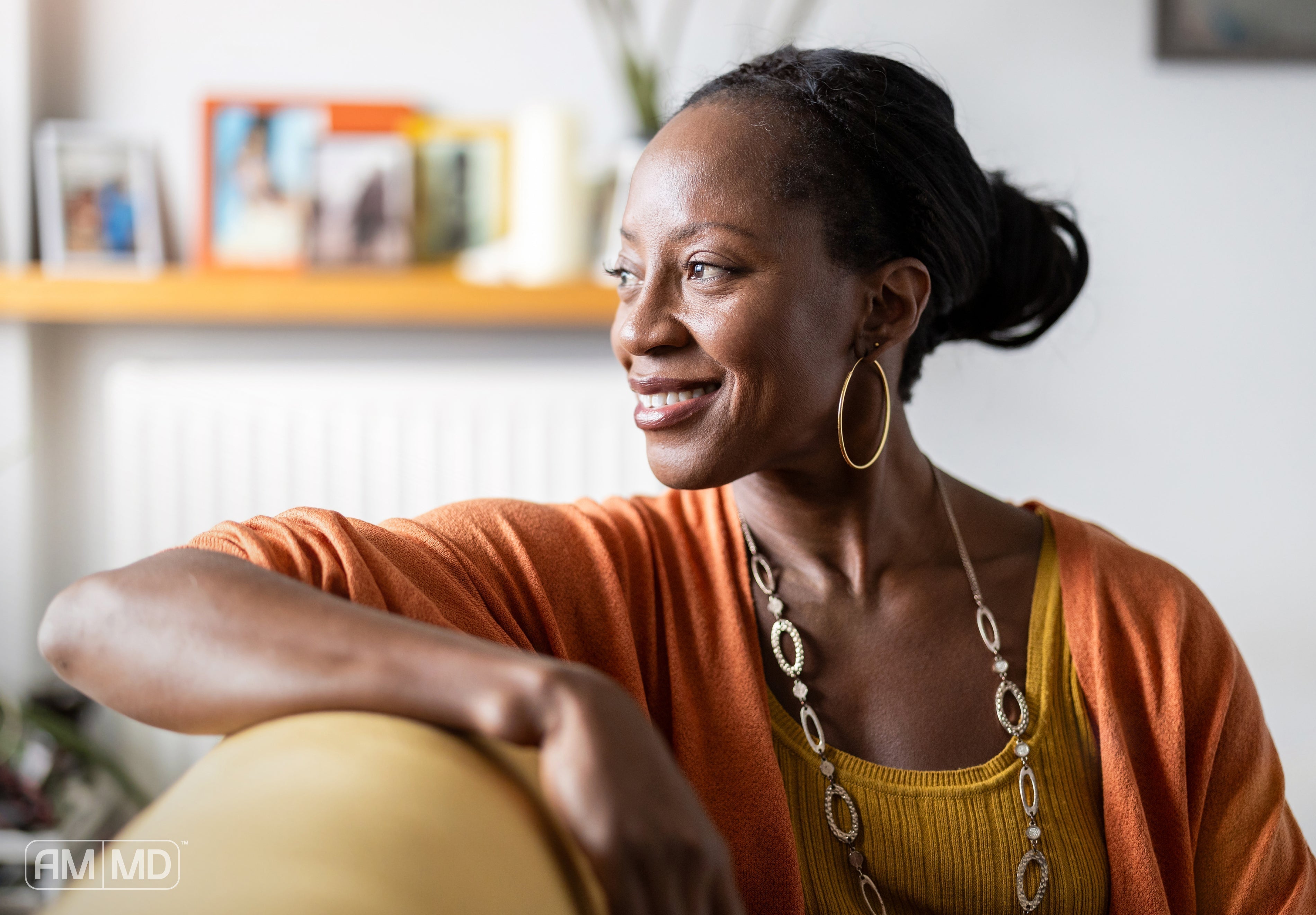 Woman sitting and smiling - Mental Health for Women: How Functional Medicine Can Support Your Emotional Well-Being - AMMD™