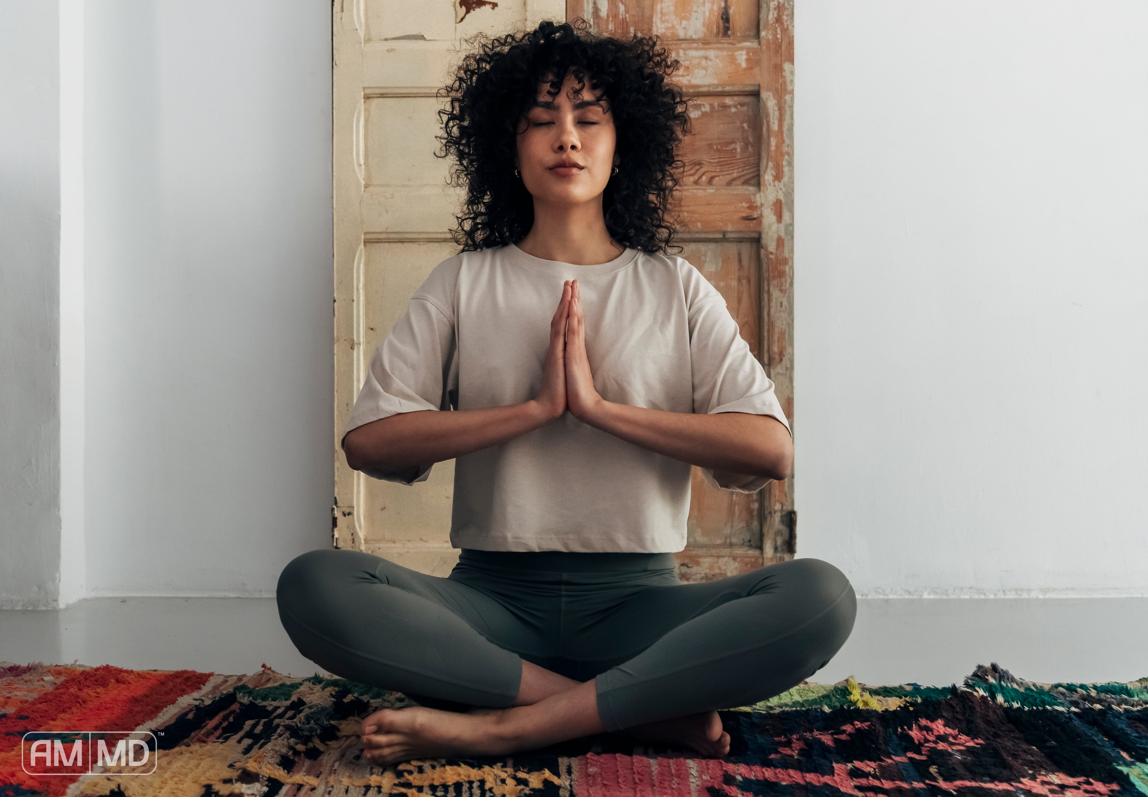 Woman meditating - 4 Natural Remedies for Hypothyroidism - AMMD™