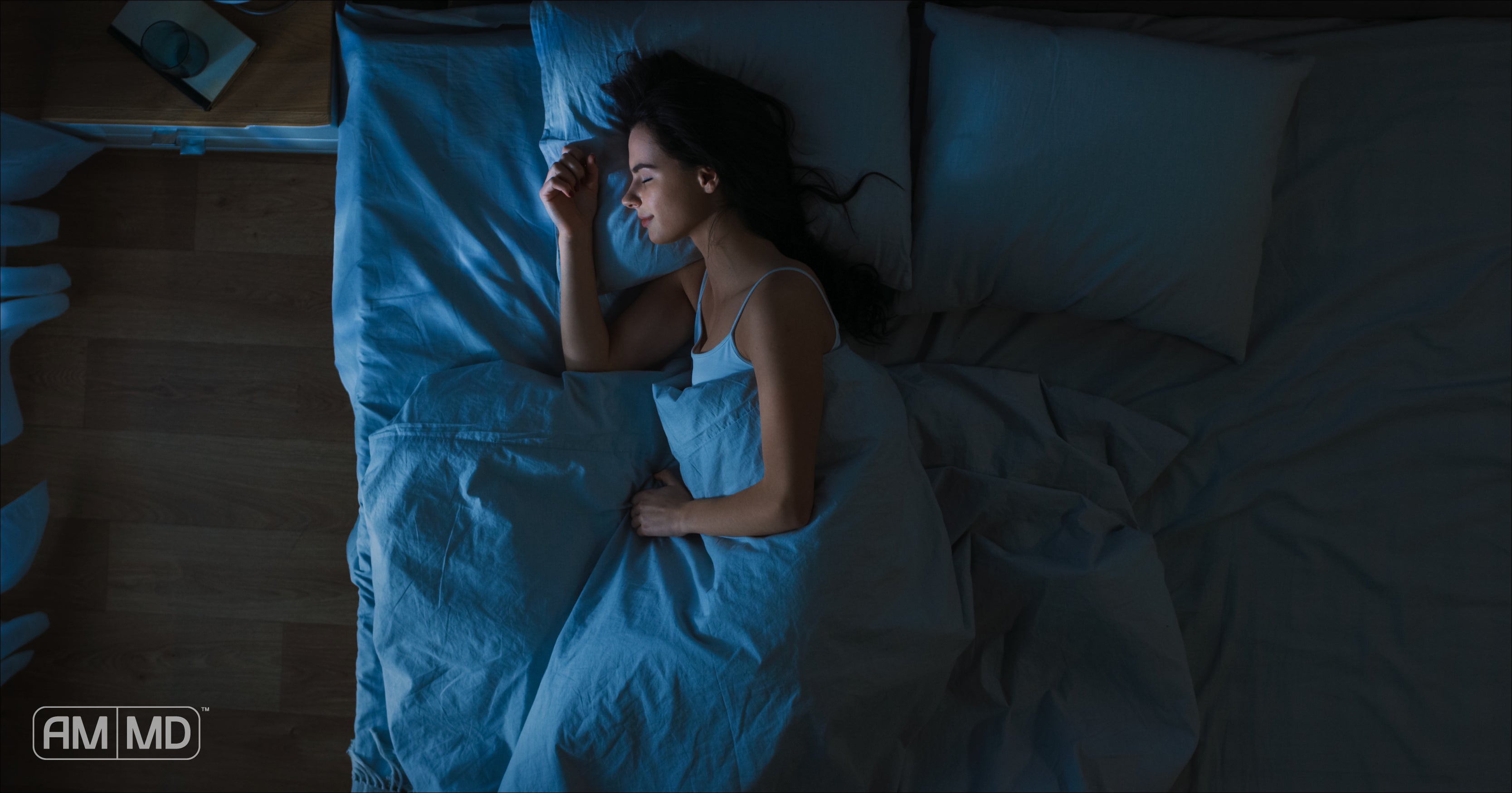 Woman sleeping in bed at night - The Benefits of Sleep for Brain Health - Amy Myers MD®