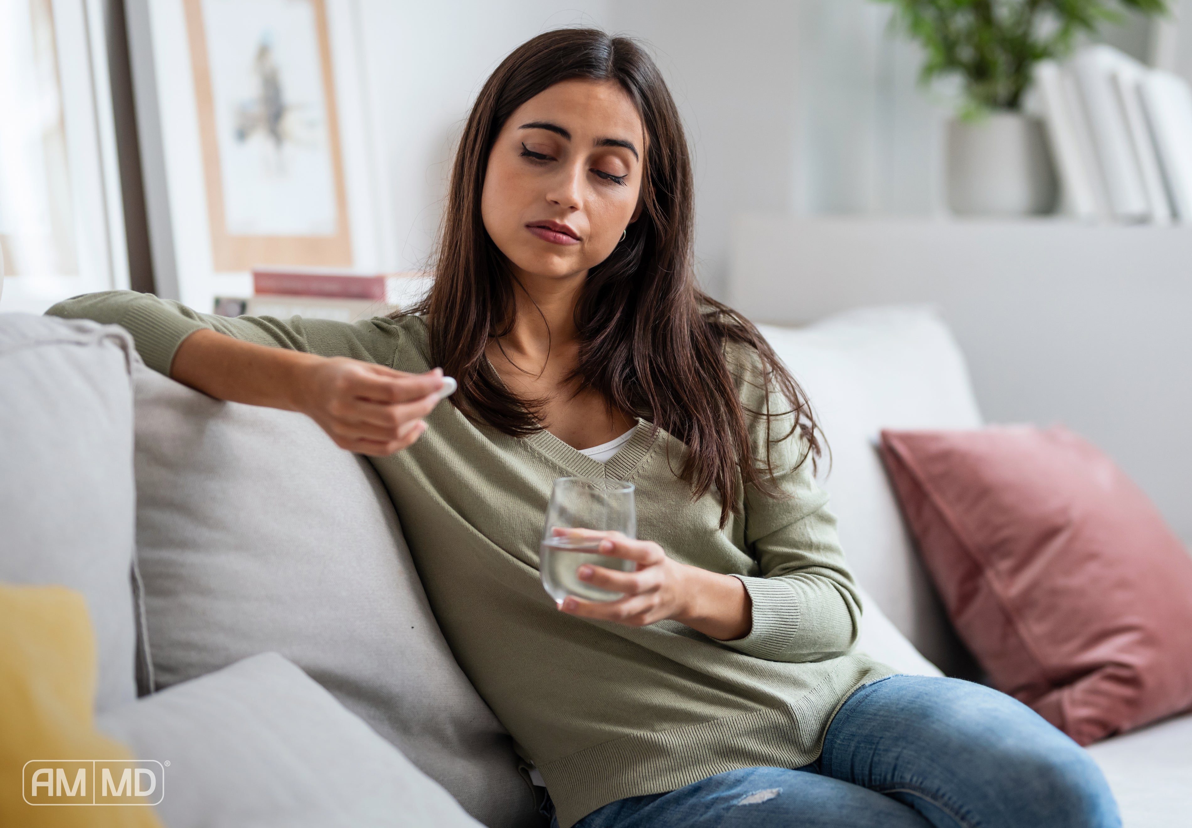 Woman taking supplement - You Can’t Out-Supplement Poor Digestion - AMMD™