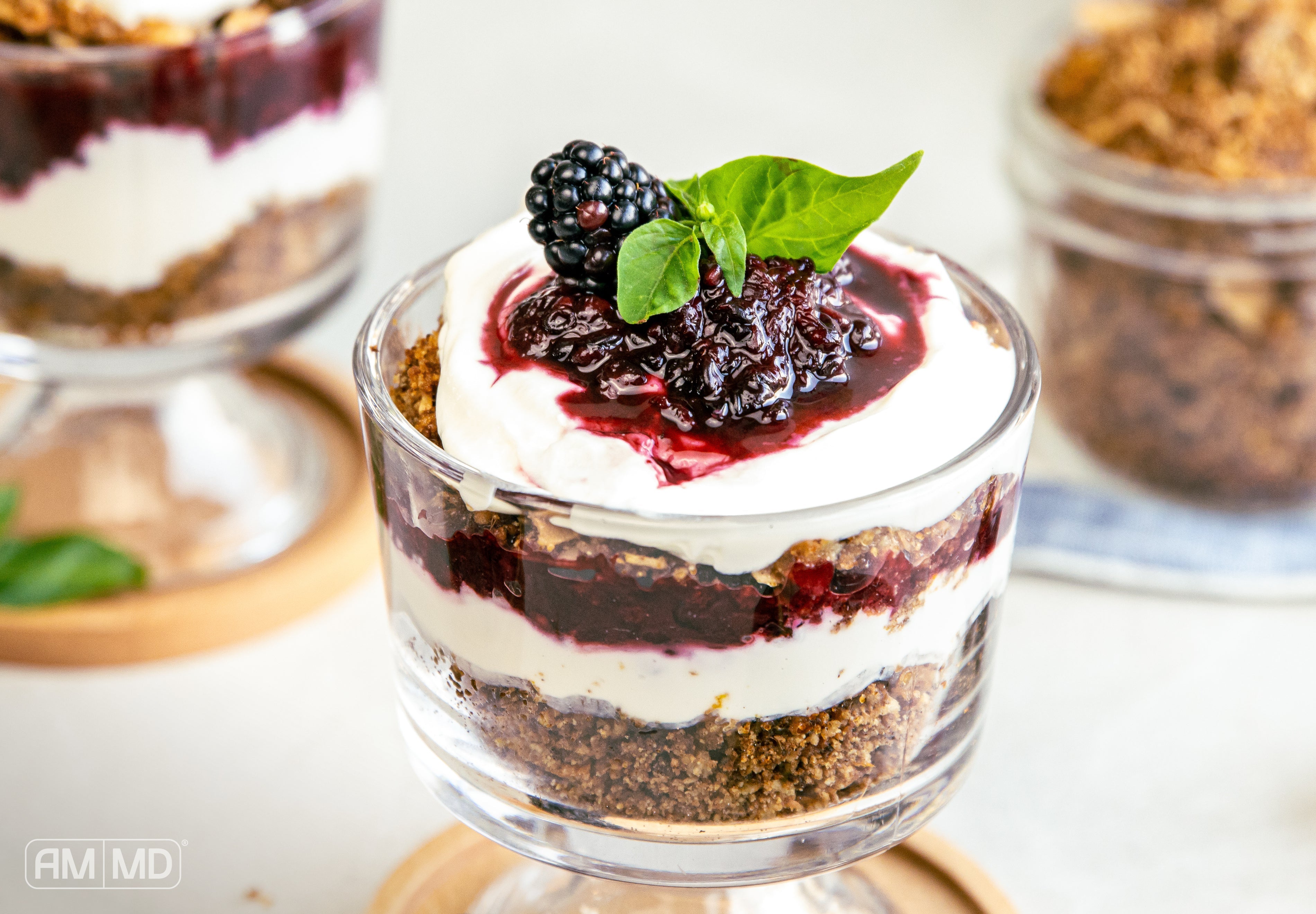 Gluten-free blackberry pie parfait layered with coconut yogurt, blackberry compote, and homemade tigernut granola
