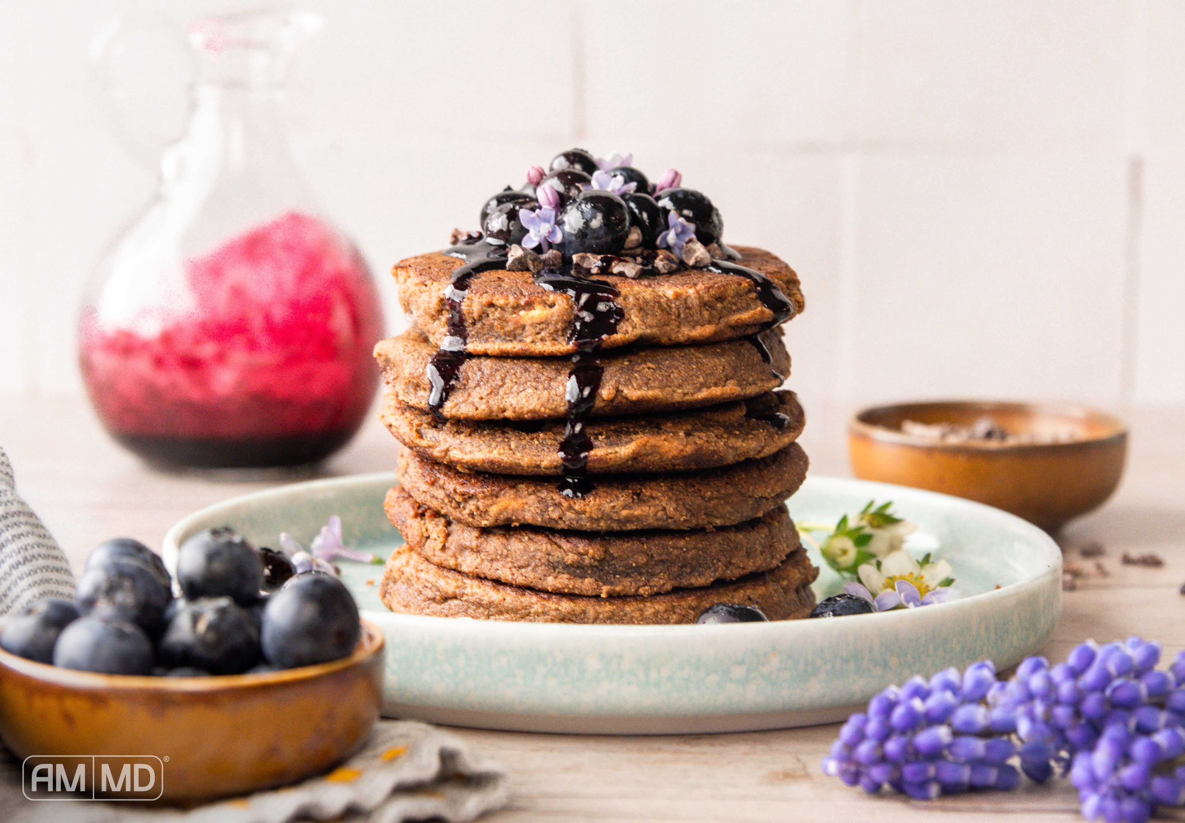 Mocha Latte Protein Pancakes topped with blueberries and chocolate drizzle for a gluten-free breakfast
