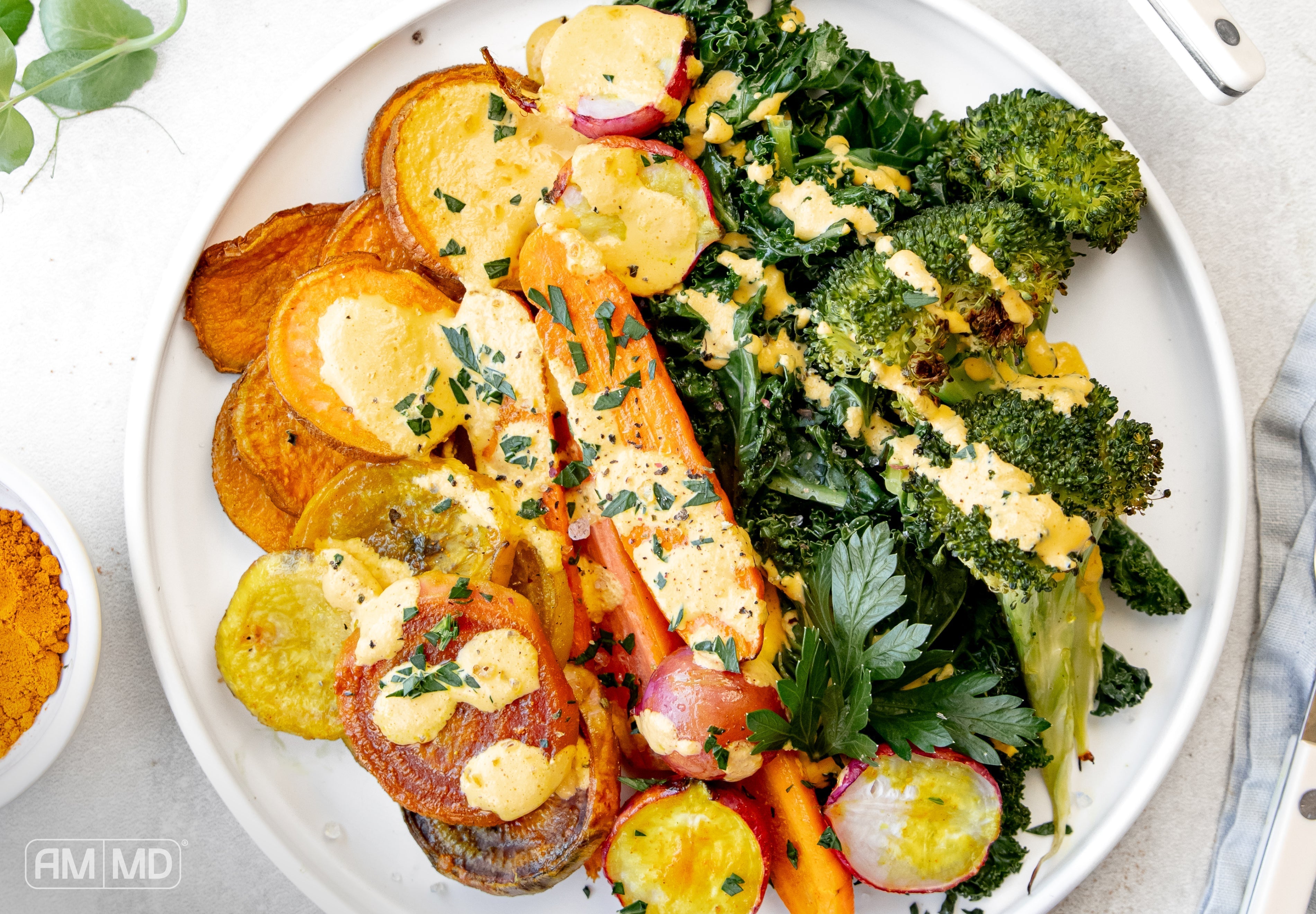 nutrient-dense rainbow vegetable bowl with roasted root vegetables, greens, and ImmuneIG dressing for gut support