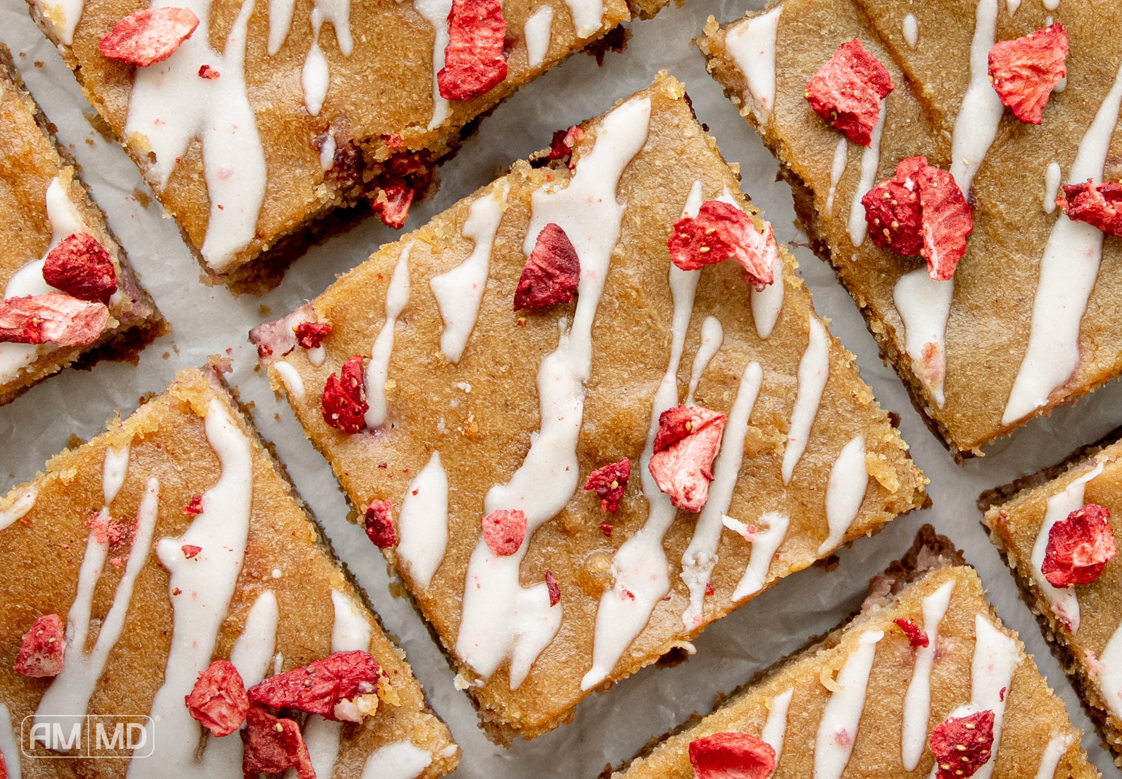 stack of strawberry blondie squares showing soft texture and strawberry pieces inside