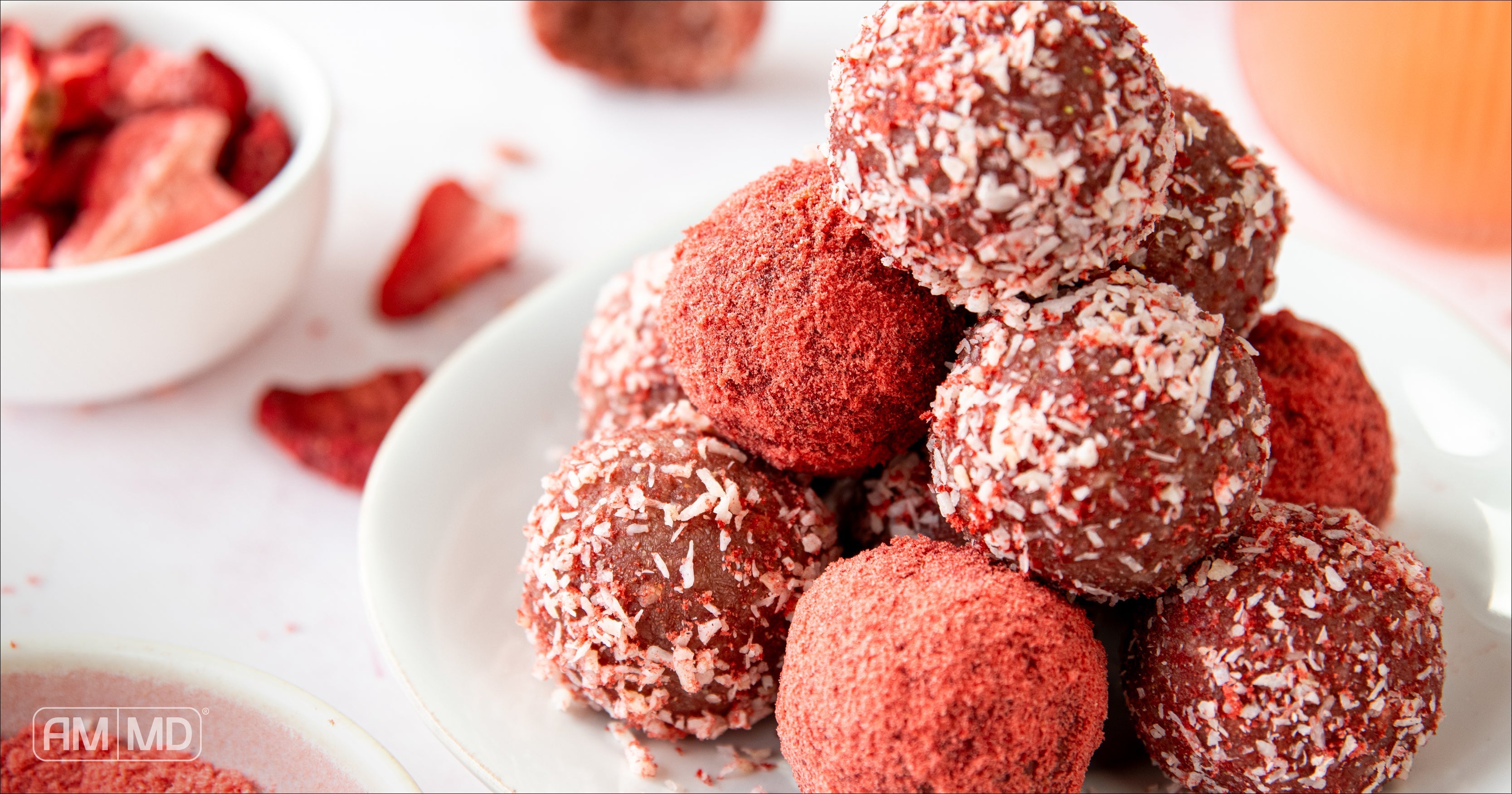 Finished strawberry lemonade bliss bites stacked on plate, AIP-friendly no-bake snack