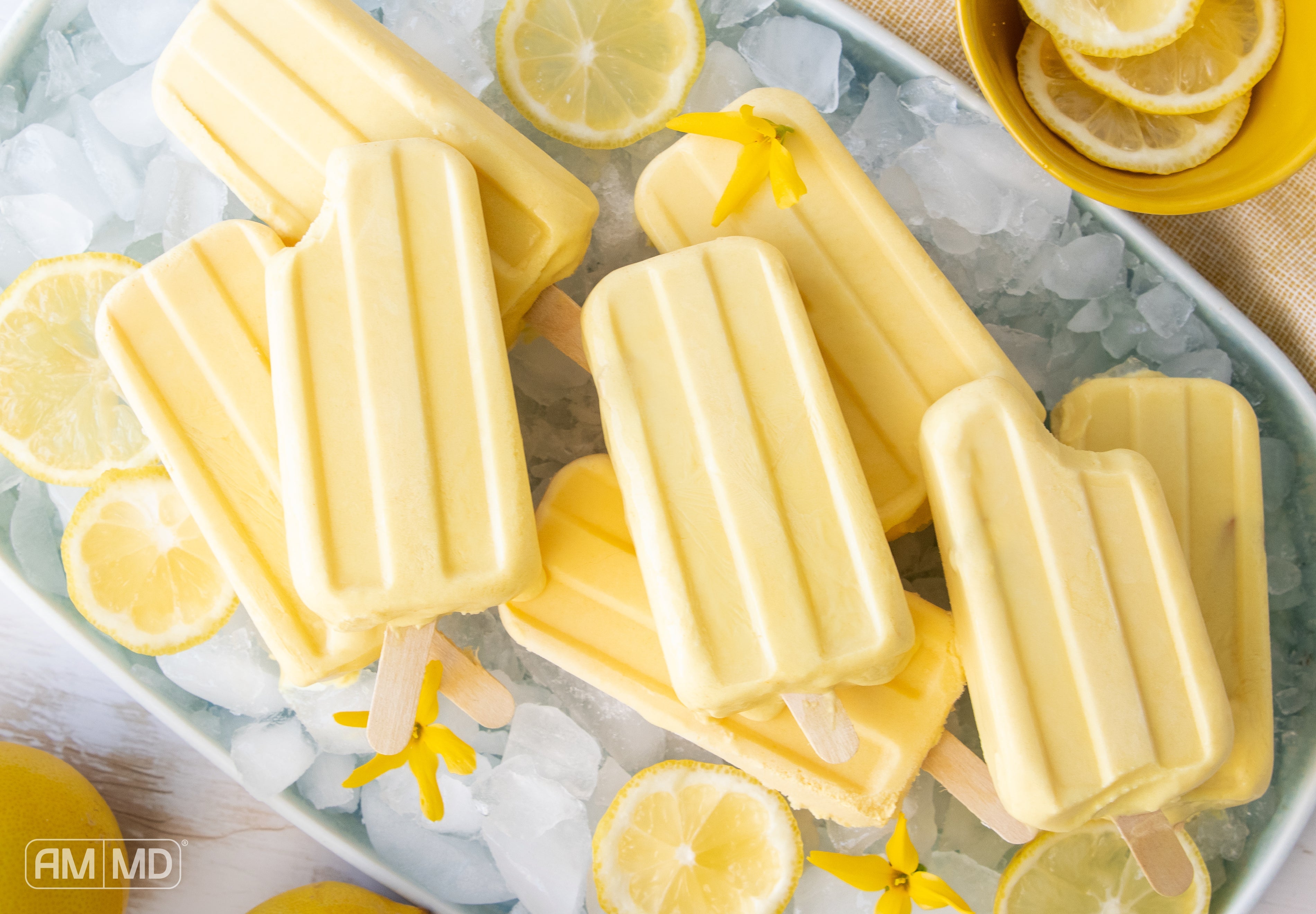 turmeric and ginger popsicles on ice with fresh lemon slices for a refreshing anti inflammatory treat