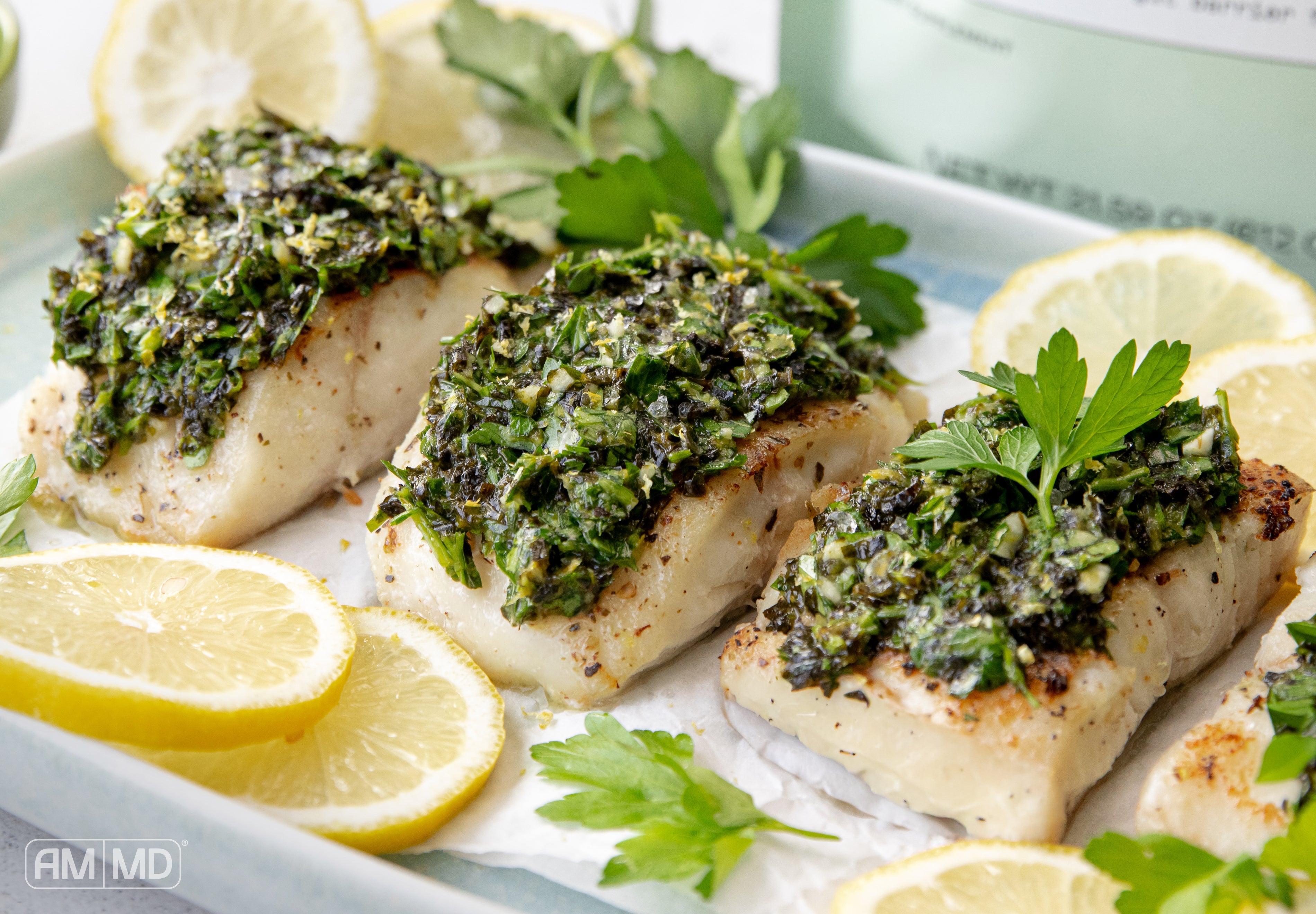 Wild caught fish with seaweed lemon gremolata garnished with lemon and herbs — AIP-friendly