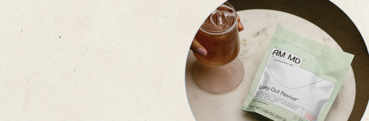A pouch of Leaky Gut Revive by Amy Myers MD, surrounded by aloe leaves and marshmallow root on a clean, light background.